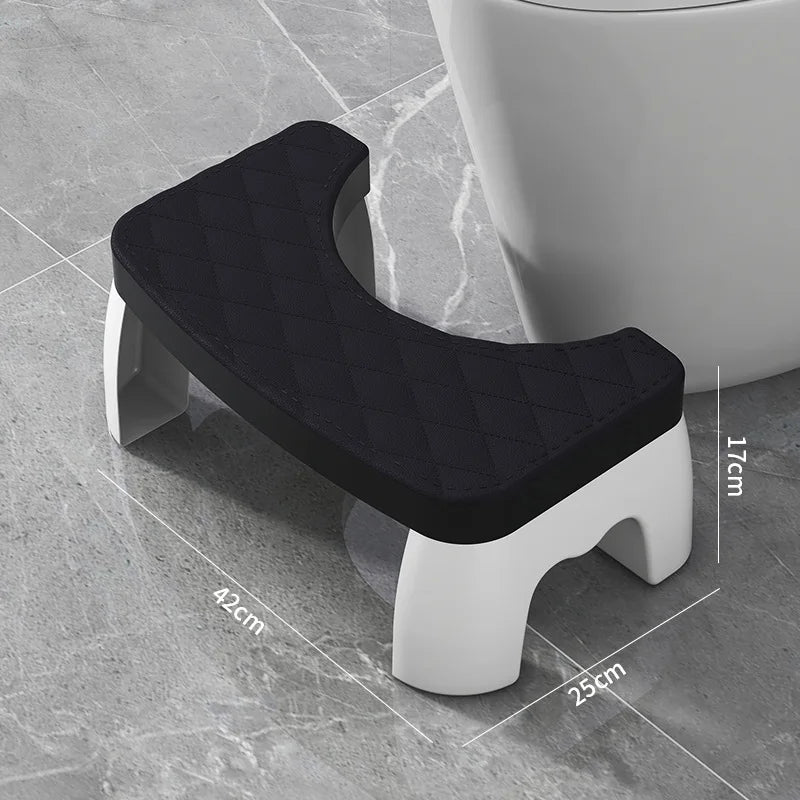 Black and white toilet stool cover with dimensions on a tiled floor