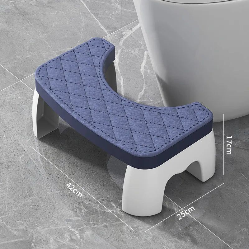 Blue and white toilet stool on a tiled floor with dimensions displayed.