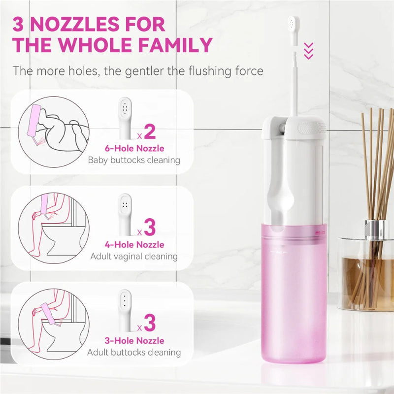 Pink and white cleaning device with nozzles for different uses