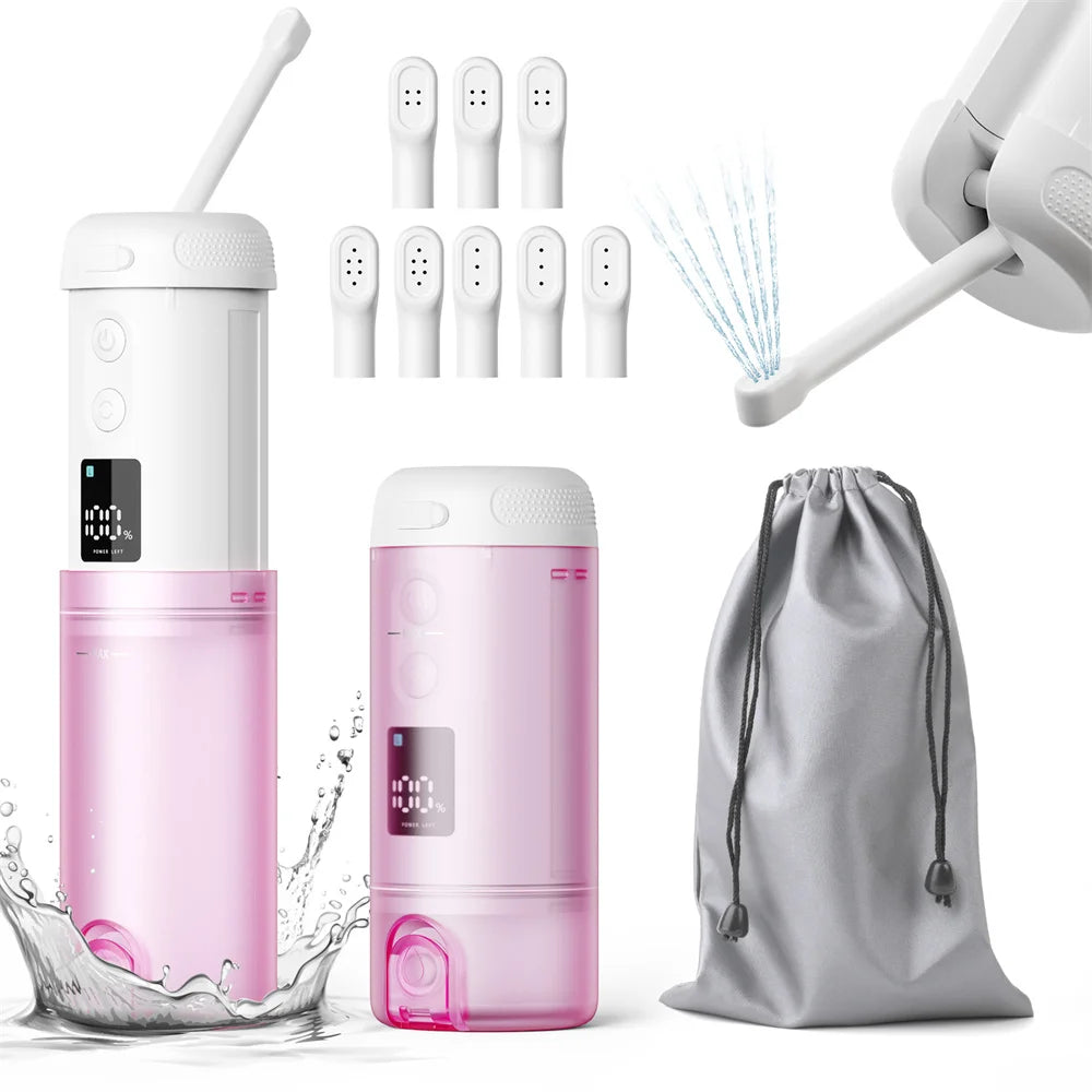 Portable pink bidet with accessories on a white background