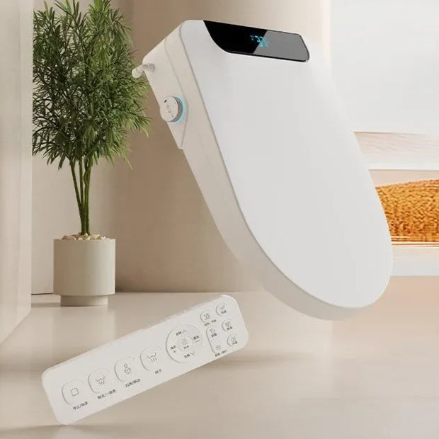 White electronic device with remote control on a light surface